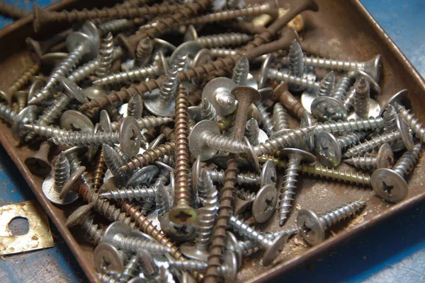 Metal screws in a metal box