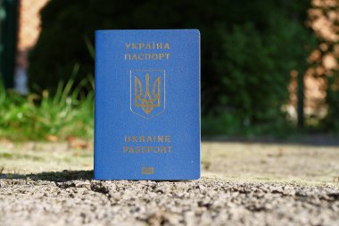 Passport of a citizen of Ukraine with a blue cover and gold letters