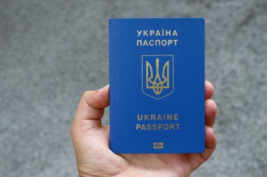 Passport of a citizen of Ukraine with a blue cover and gold letters