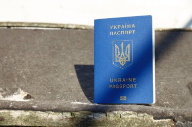 Passport of a citizen of Ukraine with a blue cover and gold letters