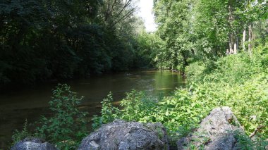 Big stones near the water and the river Seret