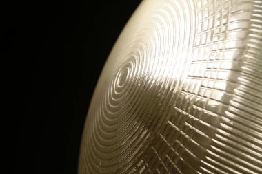 The lamp shines at night on the wall