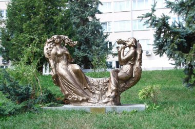 Sculpture of a young man made of concrete in the park