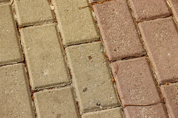 The texture of colored concrete tiles that are installed on the masonry