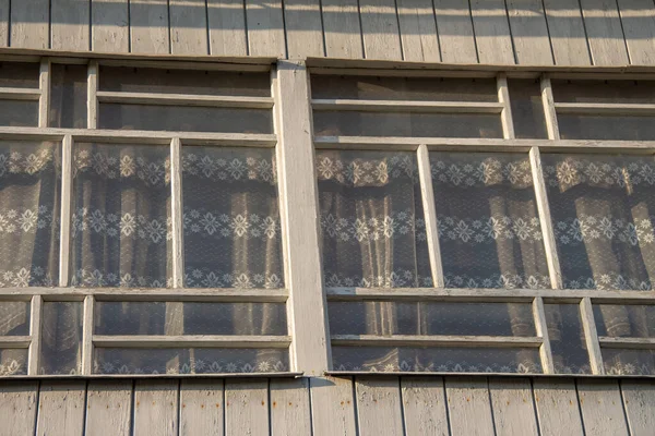 Wooden windows on the porch at dawn