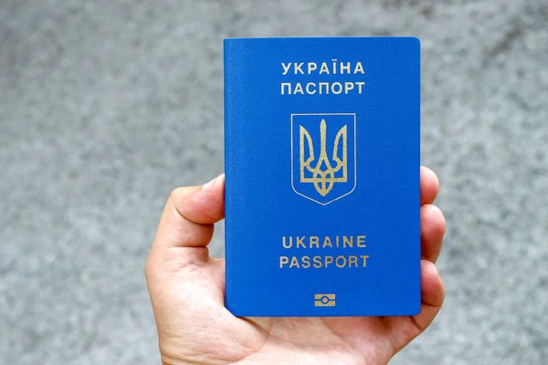 Passport of a citizen of Ukraine with a blue cover and gold letters