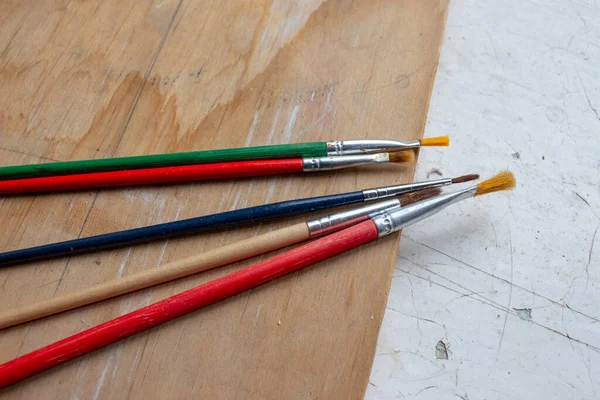 Wooden Multicolored Brushes Table — Stock Photo, Image