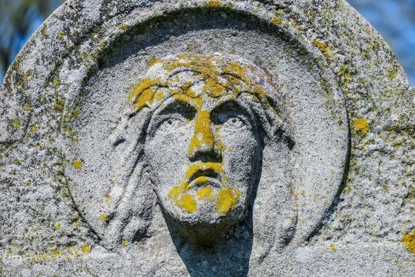 The face of Jesus Christ in the stone in the cemetery