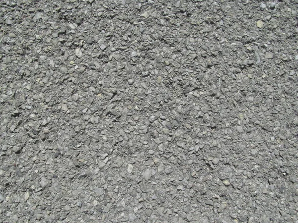 通りの背景に古い灰色のアスファルトの質感 — ストック写真