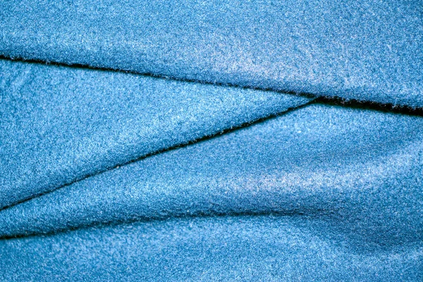 Koyu mavi katlanmış kumaş dokusu