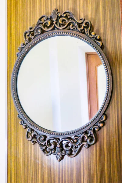 Old beautiful mirror in a metal frame