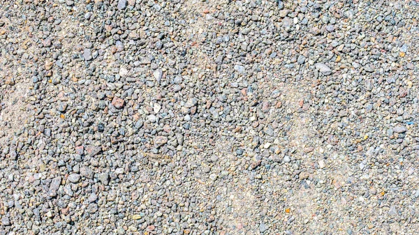地面上的小彩石结构 — 图库照片