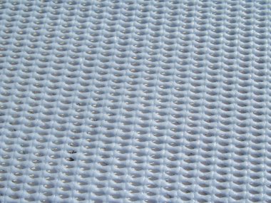 Mavi sentetik halı deseni.