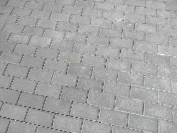 Texture of cobblestones in the park on the pedestrian zone