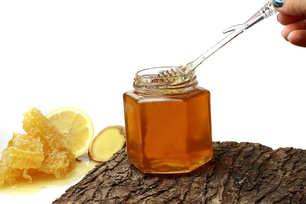 Miel en el peine, tarro de miel —  Fotos de Stock