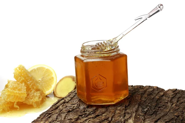 Honey in the comb , honey jar — Stock Photo, Image