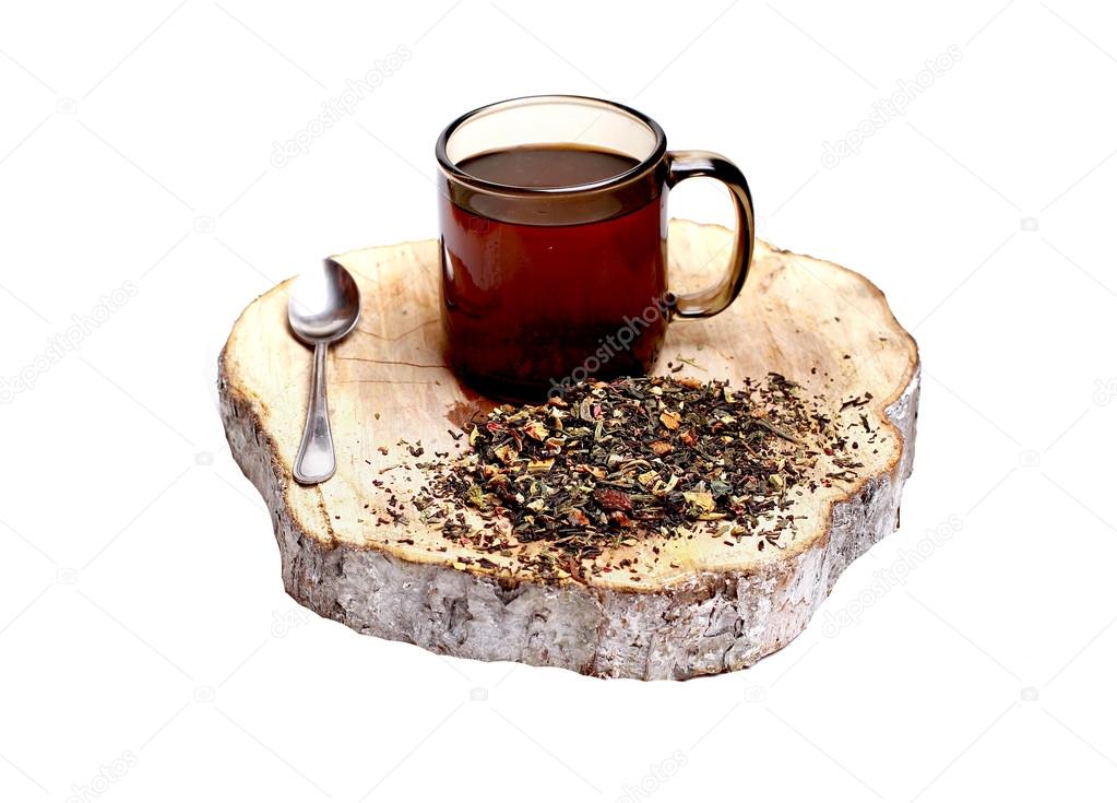 Black tea with ginseng, ginger, with the addition of apples, cinnamon, cardamom, cloves, St. John's wort, lemon peel, black pepper, mistletoe, satisfying Rooibos and crusts beans and lemongrass. in a mug on a wooden stand,herbal