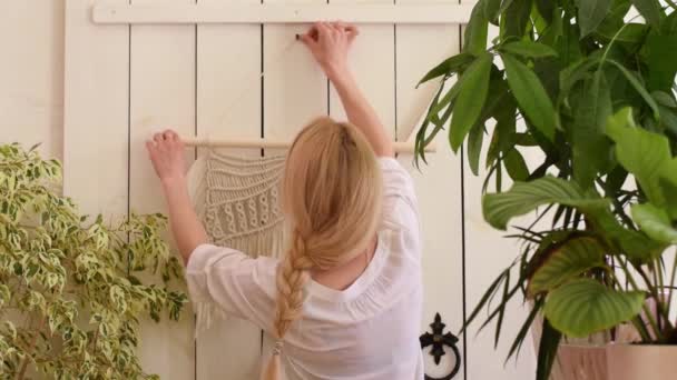 Attractive Blonde Woman Hangs Macrame Style Decor Wall Home Workshop — Stock Video