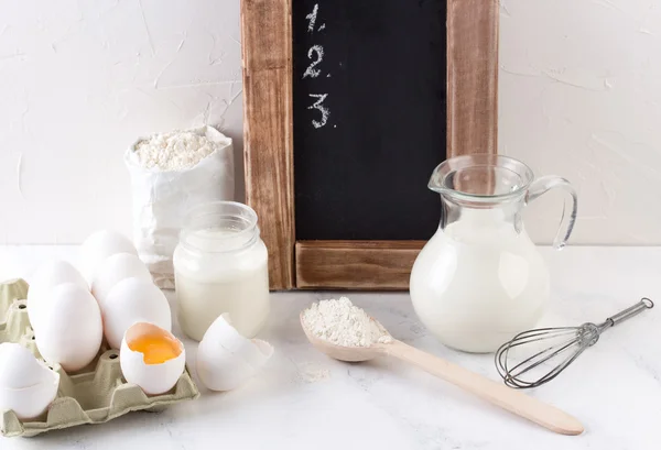 Ingredients for baking - milk, eggs and flour wheat. — Stock Photo, Image