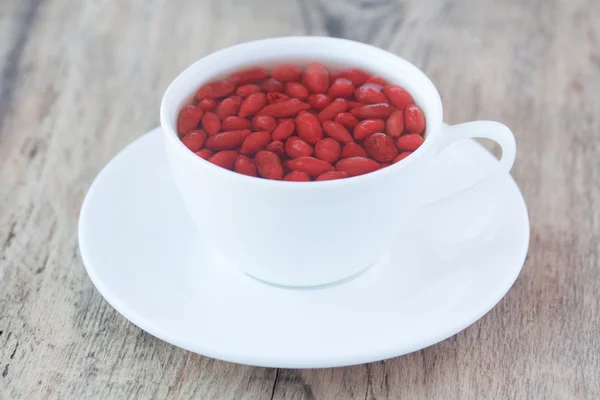 Cup of delicious dietary Goji berries tea — Stock Photo, Image