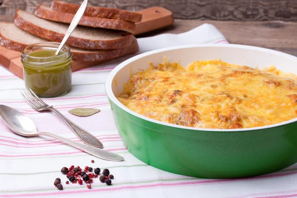 Mushrooms and cabbage casserole in frying pan with bread, pesto, pepper — Stock Photo, Image