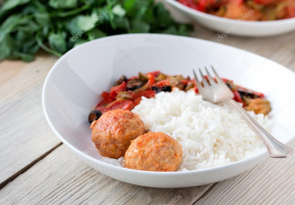 Spanish Meatballs albondigas with vegetables and cooked rice