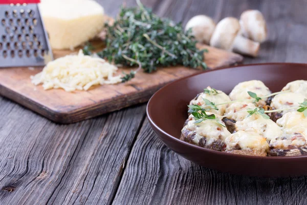 Delicious stuffed mushrooms with meat and cheese. — Stock Photo, Image