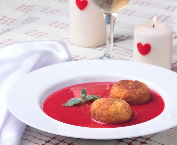 Strawberry soup with italian fried rice balls arancini. — Stock Photo, Image