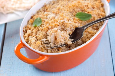 Gratin topped with a crust of breadcrumbs clipart