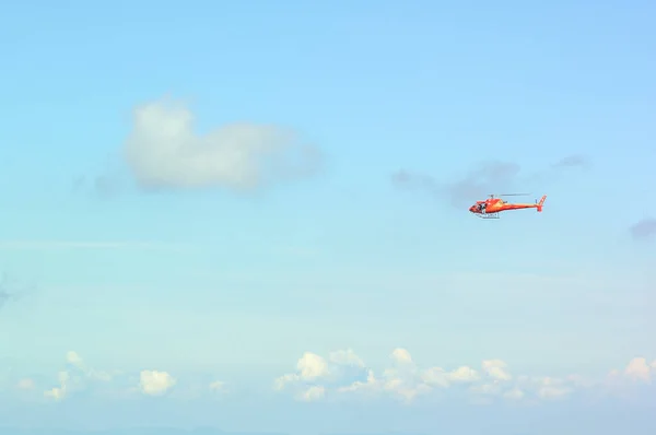 Helicopter in flight over the Swiss mountains.