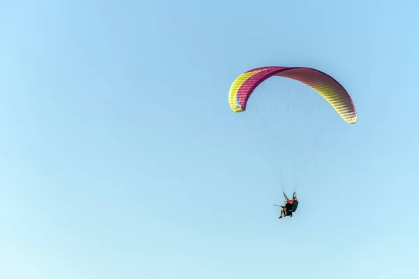 Paragliding flight in the air over the mountains. Drome, France.