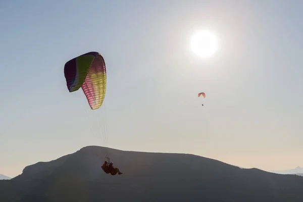 Paragliding flight in the air over the mountains. Drome, France.