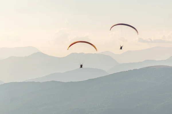 Paragliding flight in the air over the mountains. Drome, France.