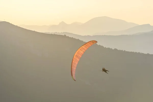 Paragliding flight in the air over the mountains. Drome, France.