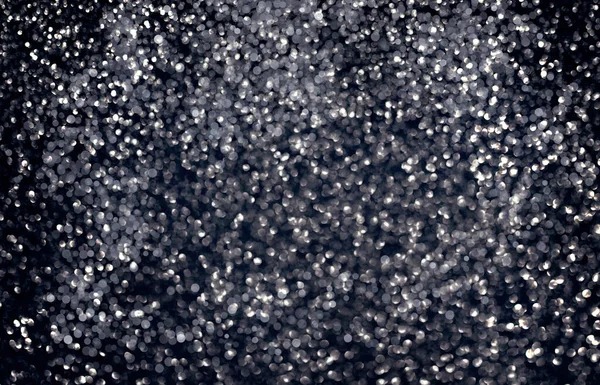 Black glitter sparkle background. Black friday shiny pattern with sequins. Christmas glamour luxury pattern, black christmas and glitter diamond background. Dark silver pattern. . High quality photo