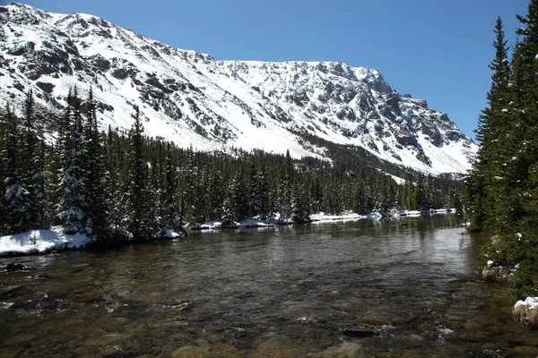 Snowy West Fork Rock Creek in Beartooth Mountains, Montana