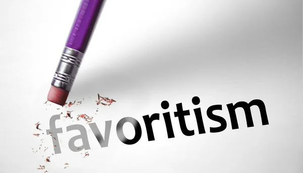 Eraser deleting the word favoritism — Stock Photo, Image