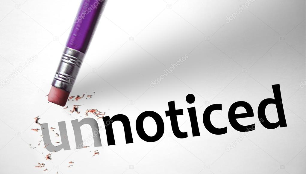 Eraser changing the word Unnoticed for Noticed — Stock Photo © klublub 62902623