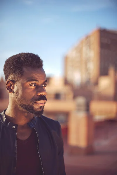 Good looking young black man in trendy clothes with negative spa