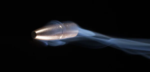 Fast bullet on black — Stock Photo, Image