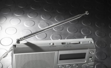 Collapsible antenna on a portable radio clipart