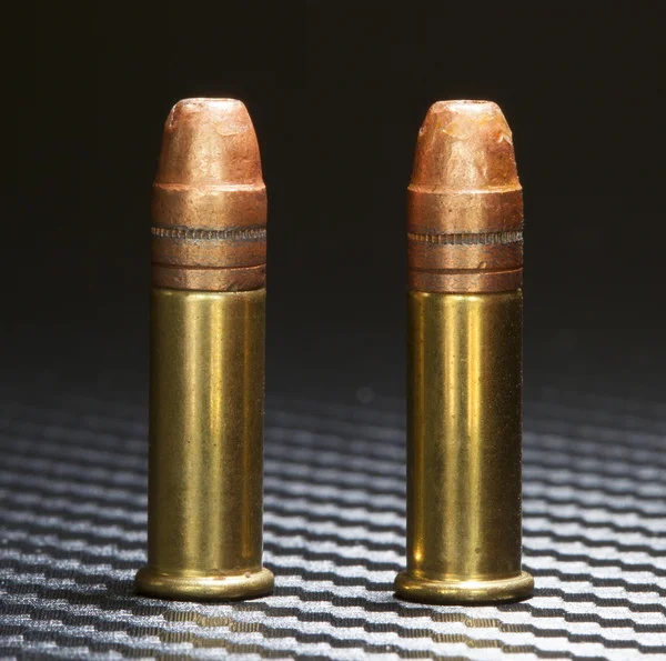 Rimfire cartridges on a dark background — Stock Photo, Image