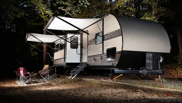 Campsite in early fall with a travel trailer at Falls Lake in North Carolina