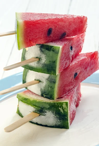 Watermelon with ice cream sticks — Stock Photo, Image