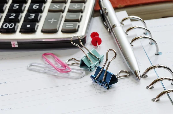 Office equipment on blank note book — Stock Photo, Image