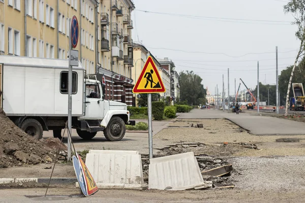 Road works sign during street reconstruction. Road signs.