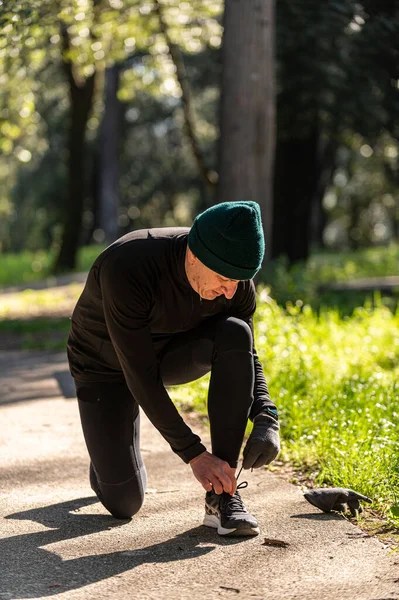 boy does physical activity in the park early in the morning