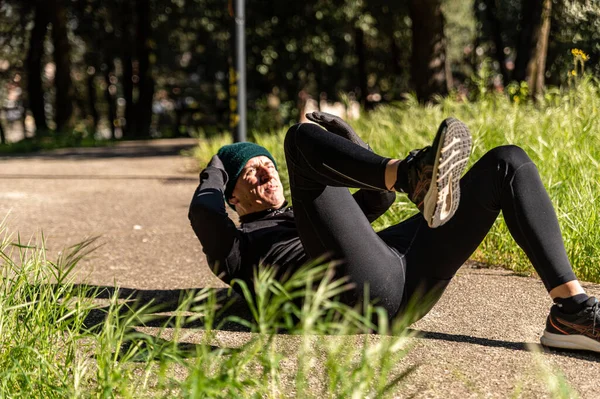 boy does physical activity in the park early in the morning