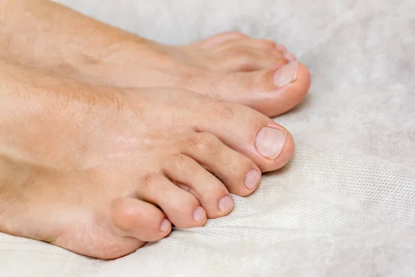 Male hardware pedicure in the salon. A series of photographs. Part seven: beautiful feet and nails after professional treatment.