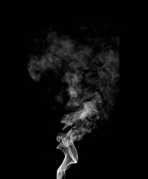 Jet of gray smoke on a black background